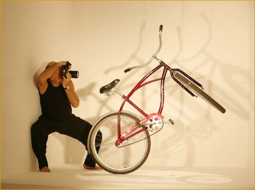 Adi Da photographing a bicycle